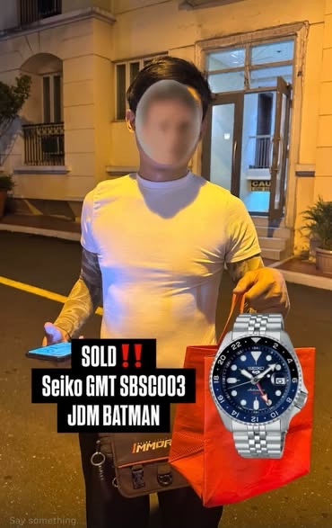 Seiko GMT SBSC003 JDM Batman handed to a buyer