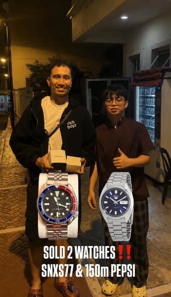 Seiko SNXS77 and Seiko 150m Pepsi handed to a buyer
